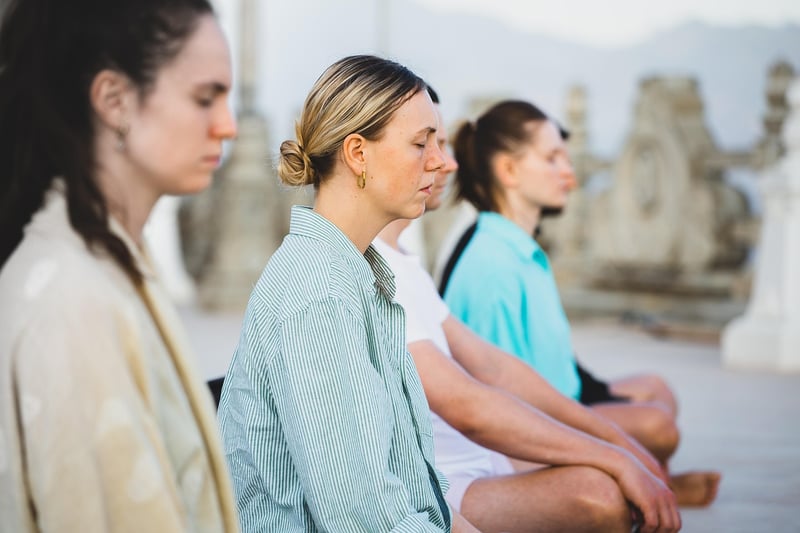 Women practicing yoga and meditation